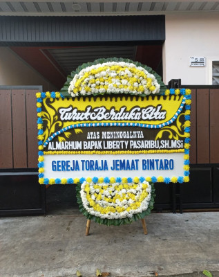Papan Bunga Duka di Pasuluhan